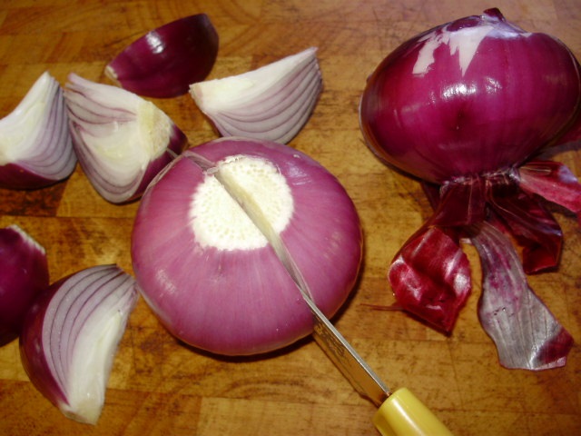 1. Peel back dry skin of onions, cut off leaving onion joined at base, cut through base into  segments