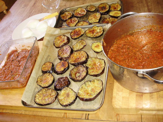 2. Assemble starting with layer roast aubergines, then thin layer tomato sauce, thin layer grated or sliced mozzarella. Repeat until you've done 3 layers