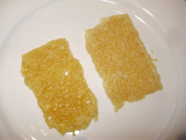 9. The Parmesan wafers cooling to crisp on a plate