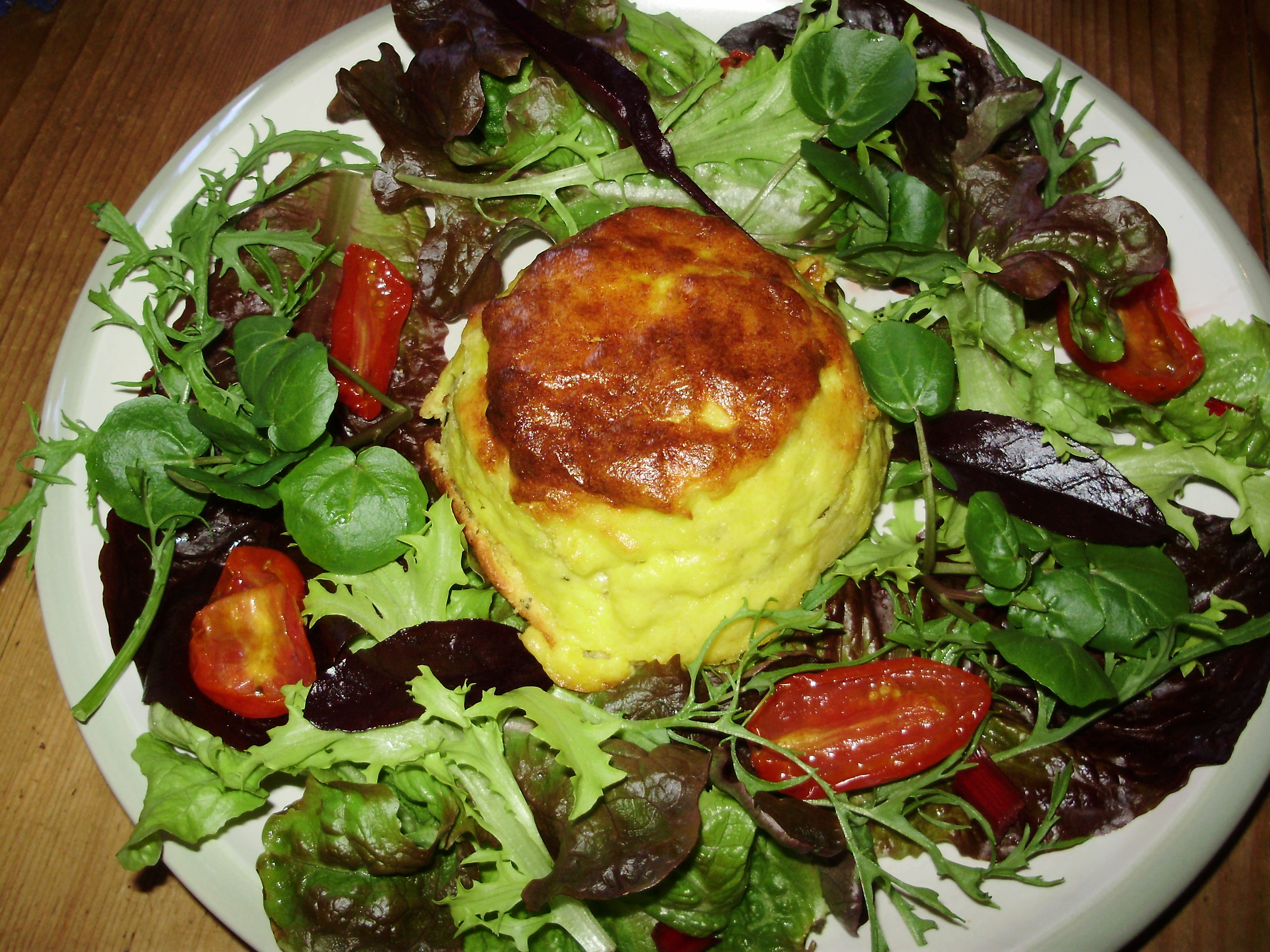 Twice-baked 2 cheese souffles, served with a seasonal salad & semi-dehydrated Rosada tomatoes