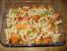 8. Mix the lightly cooked veg into the cooked pasta, then pour sauce over it & top with more cheese!